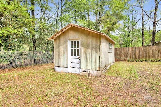 view of shed with a fenced backyard