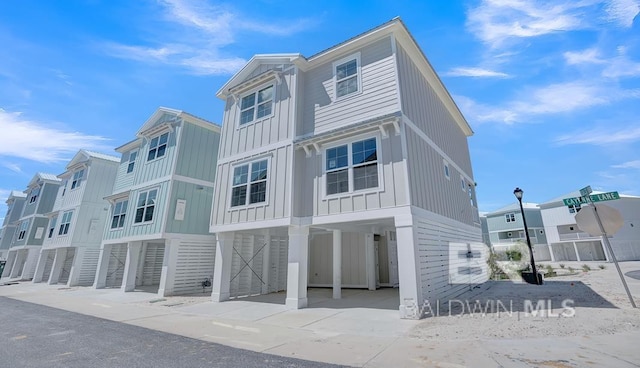 view of front of house with a carport and board and batten siding