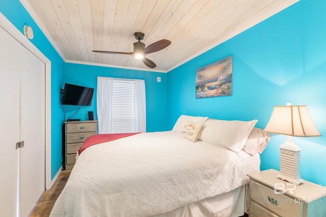 bedroom featuring ornamental molding, ceiling fan, and wooden ceiling