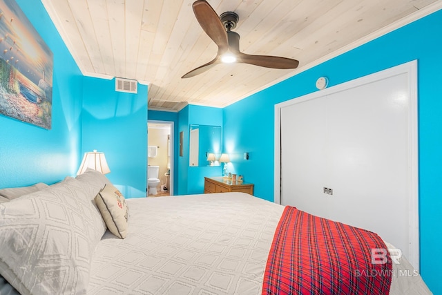 bedroom featuring ensuite bathroom, ceiling fan, wood ceiling, and ornamental molding