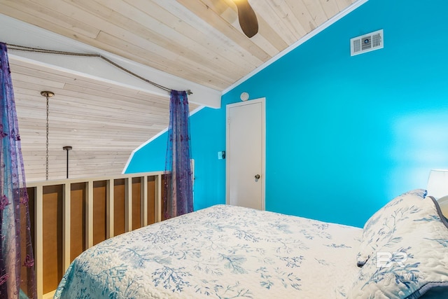 bedroom featuring vaulted ceiling, wooden ceiling, and ceiling fan