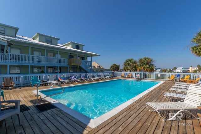 view of pool with a wooden deck