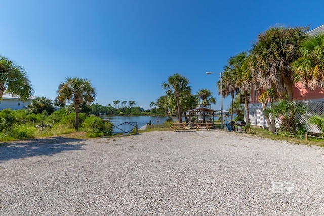 view of home's community featuring a gazebo and a water view