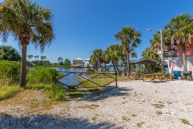 exterior space with a gazebo and a water view