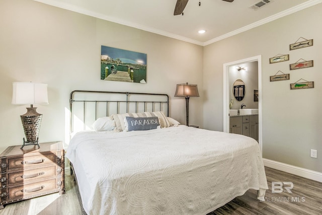 bedroom with ensuite bath, hardwood / wood-style flooring, crown molding, and ceiling fan