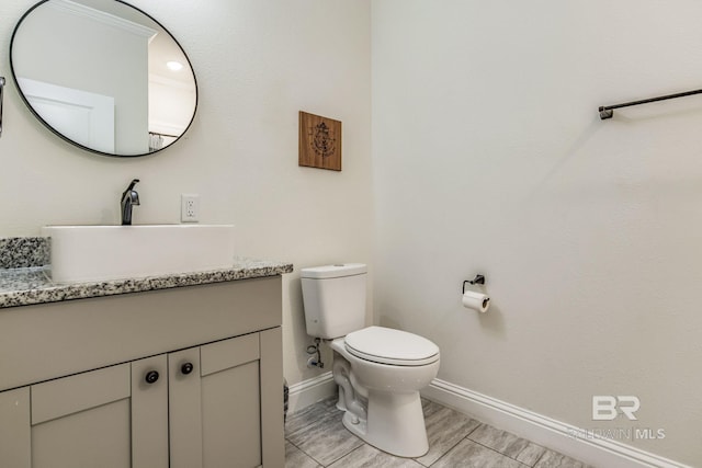 bathroom with toilet and vanity