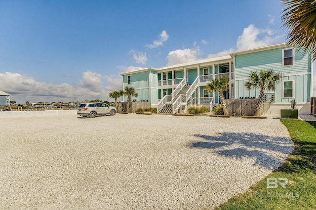 17290 Perdido Key Dr Unit A1, Pensacola, FL 32507 - view of front of property with central air condition unit, stairs, and fence