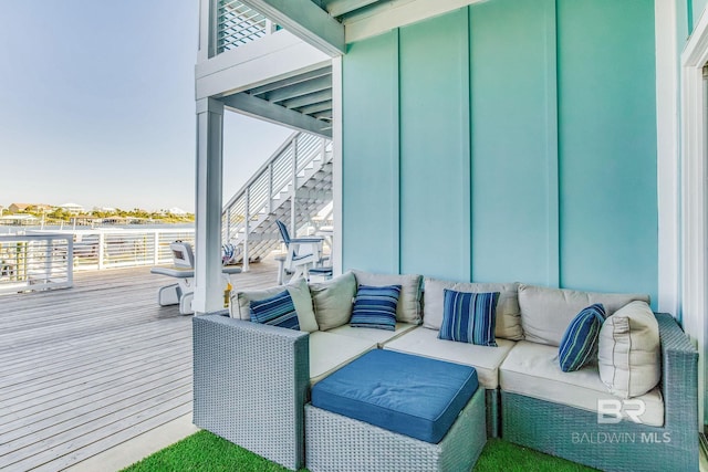 wooden terrace with outdoor lounge area