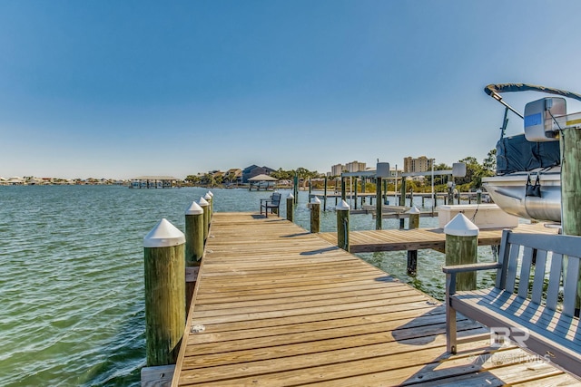 dock area featuring a water view