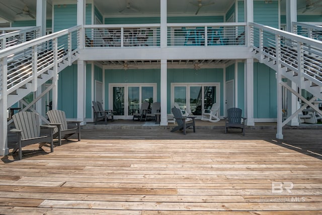 17290 Perdido Key Dr Unit A1, Pensacola, FL 32507 - wooden deck with ceiling fan and stairway