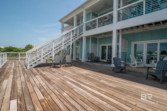 17290 Perdido Key Dr Unit A1, Pensacola, FL 32507 - wooden deck featuring ceiling fan and stairs