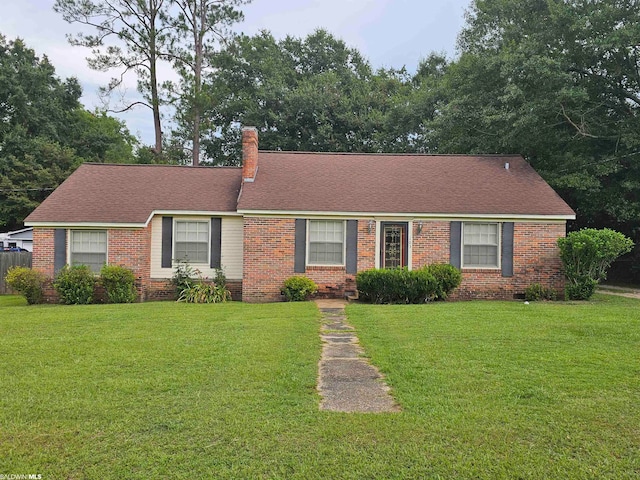 single story home with a front lawn