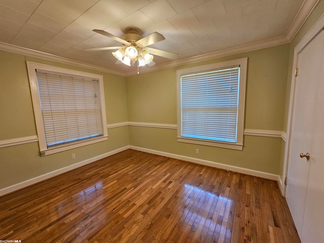 unfurnished room with crown molding, ceiling fan, and dark hardwood / wood-style flooring