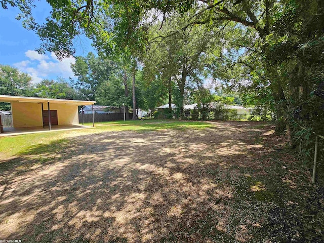 view of yard with a carport