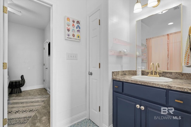 5570 Bay La Launch Ave, Orange Beach, AL 36561 - full bathroom featuring vanity and a closet