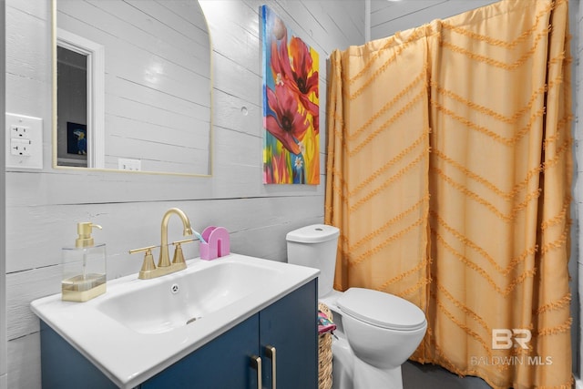 5570 Bay La Launch Ave, Orange Beach, AL 36561 - full bath with wood walls, vanity, and toilet