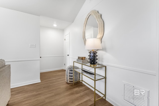 corridor with recessed lighting, baseboards, and wood finished floors