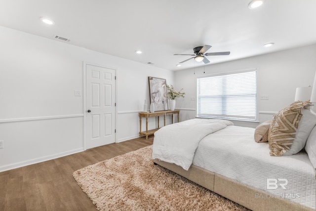 bedroom featuring visible vents, baseboards, recessed lighting, wood finished floors, and a ceiling fan