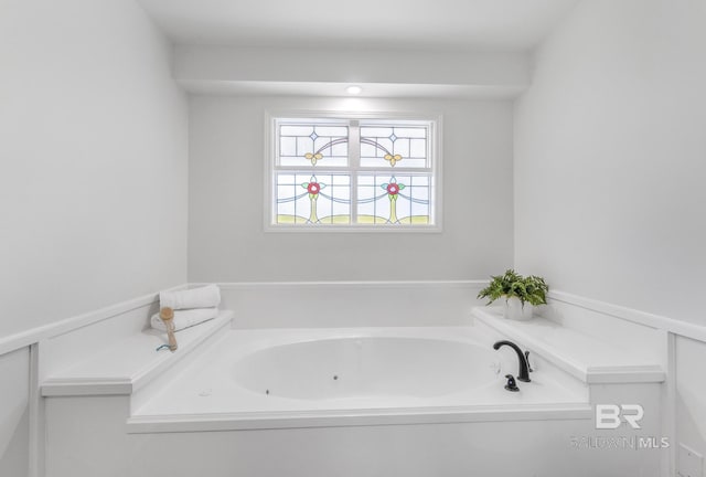 full bath featuring a tub with jets