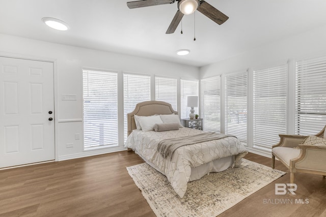 bedroom featuring ceiling fan and wood finished floors