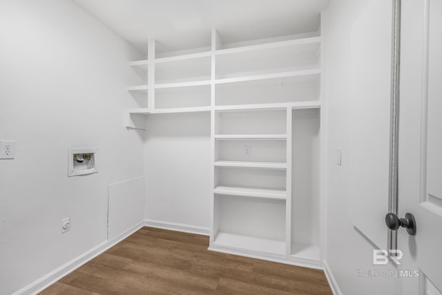 washroom featuring wood finished floors, baseboards, laundry area, electric dryer hookup, and washer hookup