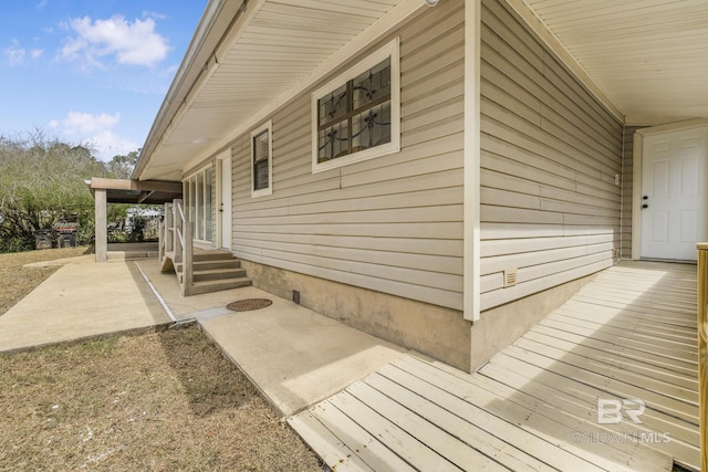 view of side of property featuring entry steps and a patio