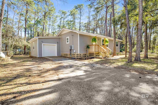 view of front of home featuring driveway and an attached garage