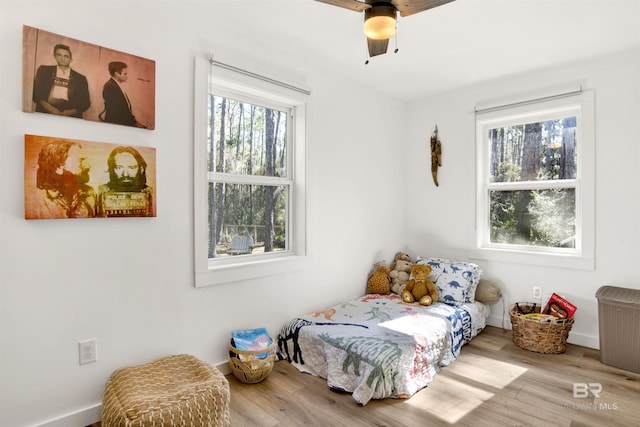 bedroom featuring ceiling fan and wood finished floors