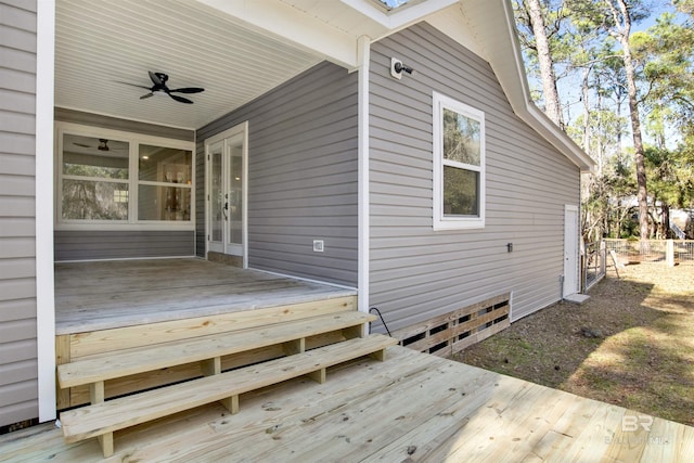 wooden terrace featuring a ceiling fan and french doors