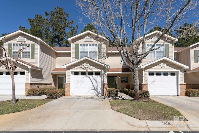 view of front of home with brick siding and driveway