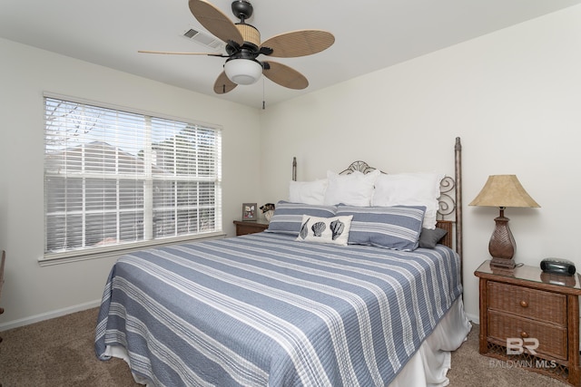 bedroom featuring visible vents, baseboards, carpet, and a ceiling fan