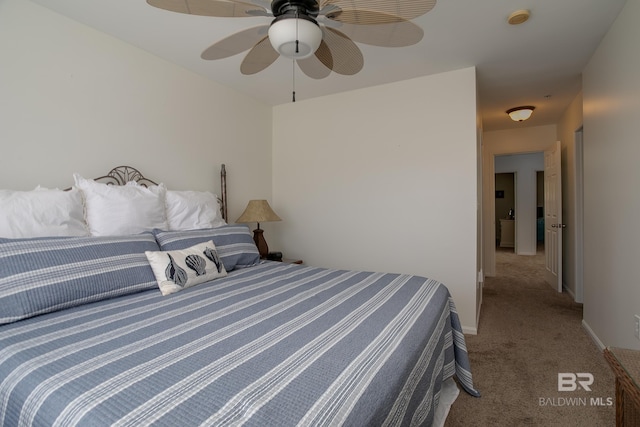 bedroom with a ceiling fan, carpet, and baseboards