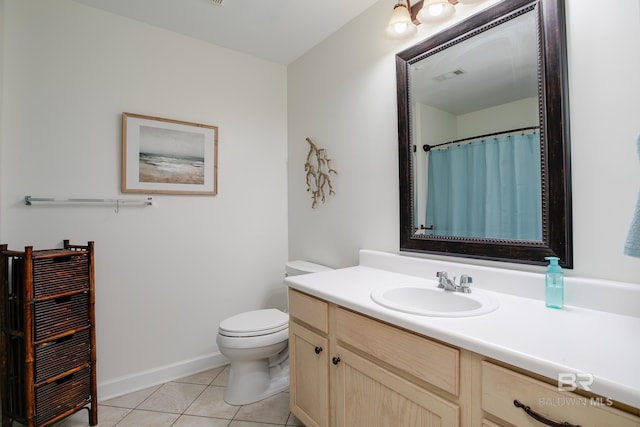 full bathroom with vanity, baseboards, visible vents, tile patterned floors, and toilet