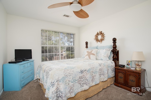 bedroom featuring visible vents, carpet floors, and ceiling fan