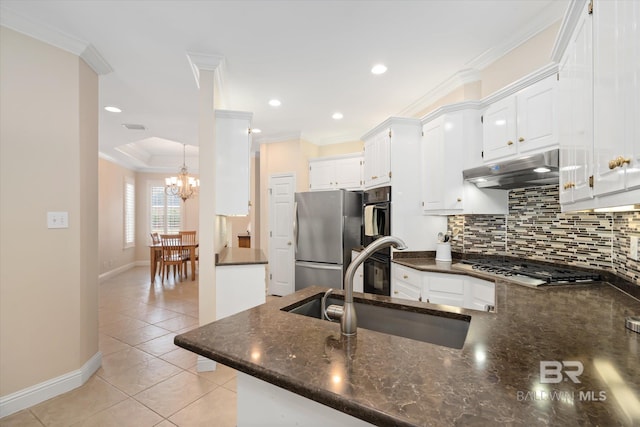 kitchen with sink, crown molding, stainless steel appliances, white cabinets, and kitchen peninsula