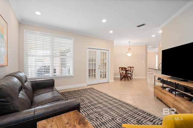 living room featuring ornamental molding, french doors, and light tile patterned flooring