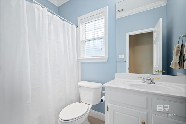 bathroom featuring ornamental molding, vanity, and toilet