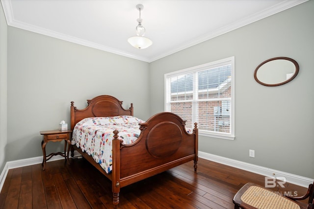 bedroom featuring ornamental molding and dark hardwood / wood-style floors