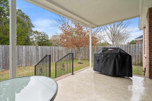 view of patio with a grill