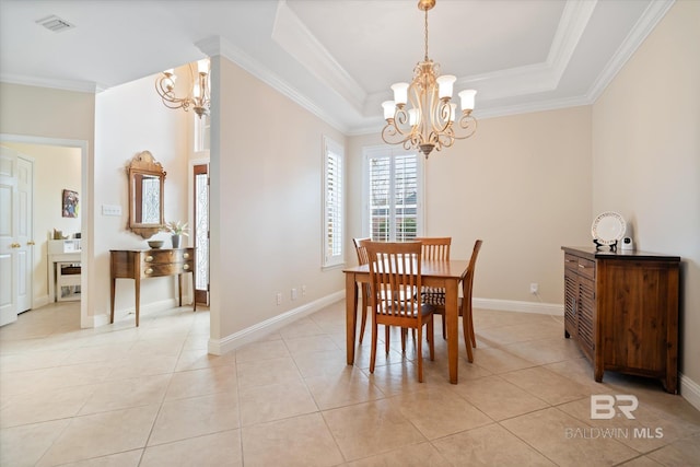 tiled dining area featuring crown molding, a notable chandelier, and a tray ceiling