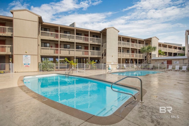 view of pool featuring a patio