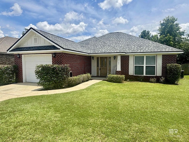 8185 Savage Loop, Theodore, AL 36582 - single story home featuring a garage, brick siding, concrete driveway, a front lawn, and roof with shingles