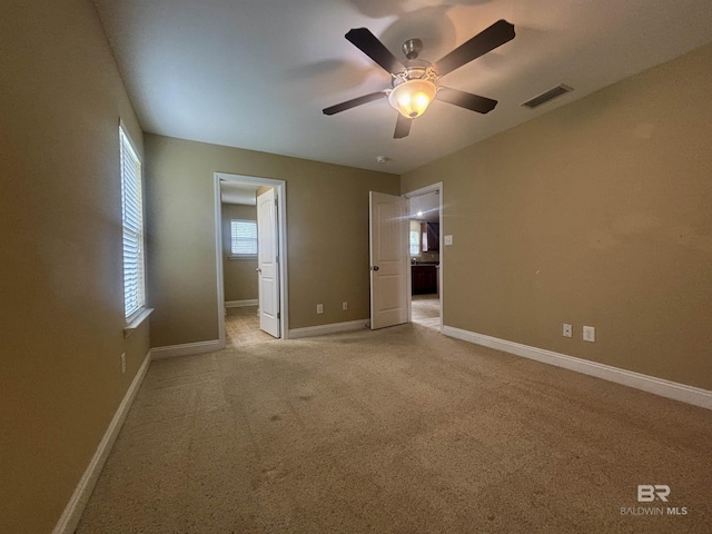 8185 Savage Loop, Theodore, AL 36582 - unfurnished room with light colored carpet and a ceiling fan