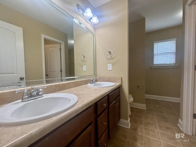 8185 Savage Loop, Theodore, AL 36582 - full bathroom featuring double vanity and tile patterned flooring