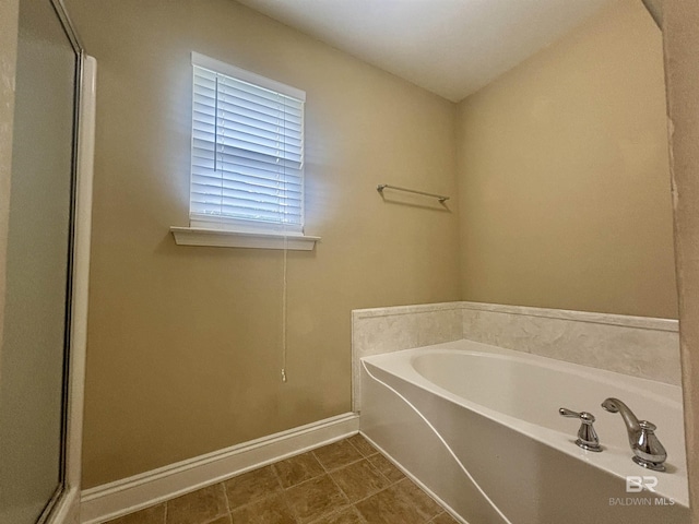 8185 Savage Loop, Theodore, AL 36582 - full bathroom featuring a bath and a shower stall