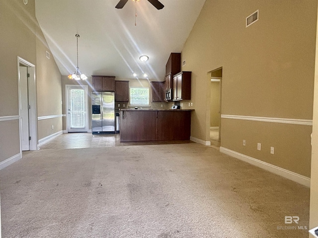 8185 Savage Loop, Theodore, AL 36582 - kitchen featuring stainless steel appliances, open floor plan, ceiling fan, lofted ceiling, and a peninsula
