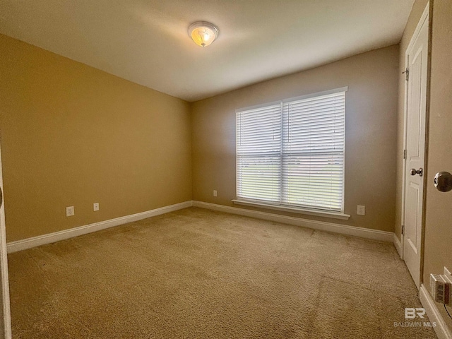 8185 Savage Loop, Theodore, AL 36582 - spare room with light carpet and baseboards