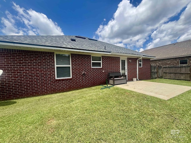 8185 Savage Loop, Theodore, AL 36582 - back of house featuring a patio, roof with shingles, and brick siding