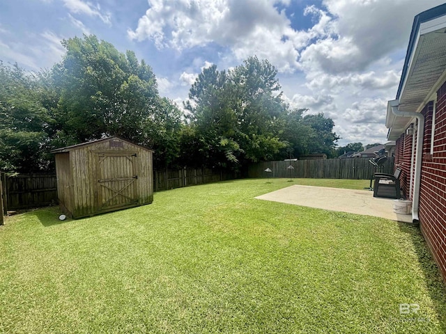 8185 Savage Loop, Theodore, AL 36582 - fenced backyard featuring a patio area and a storage unit