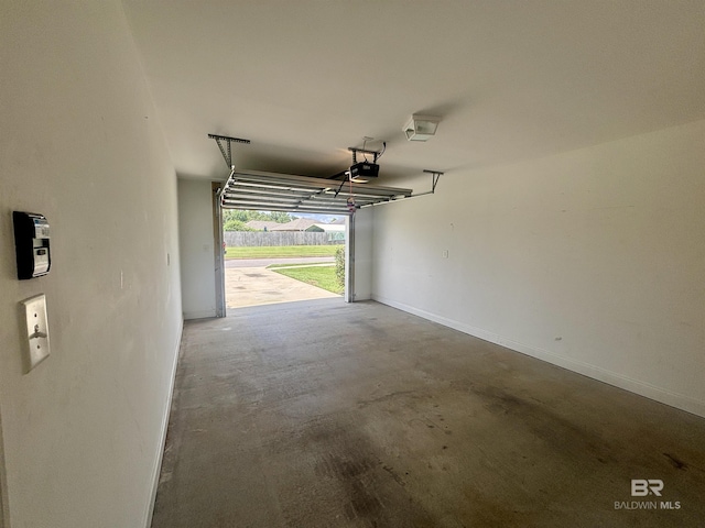 8185 Savage Loop, Theodore, AL 36582 - garage with a garage door opener and baseboards